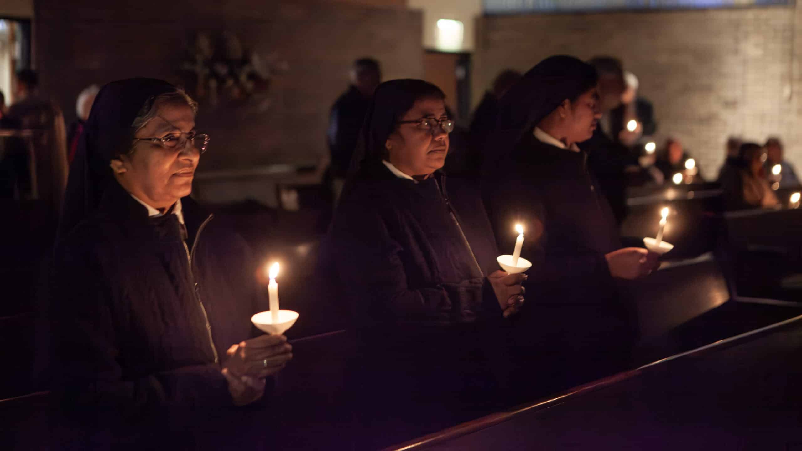 Sisters holding candles